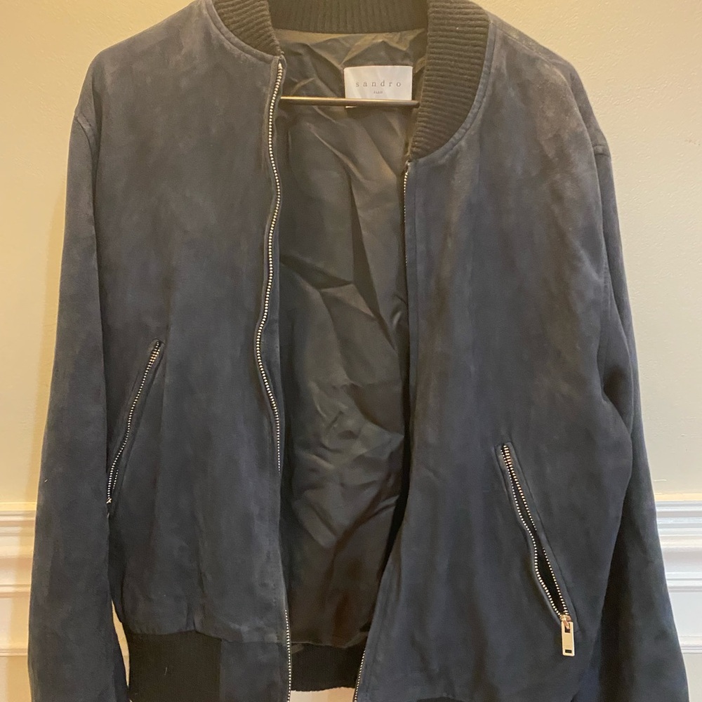 Navy blue jacket. Size M with pockets inside and outside. Great condition